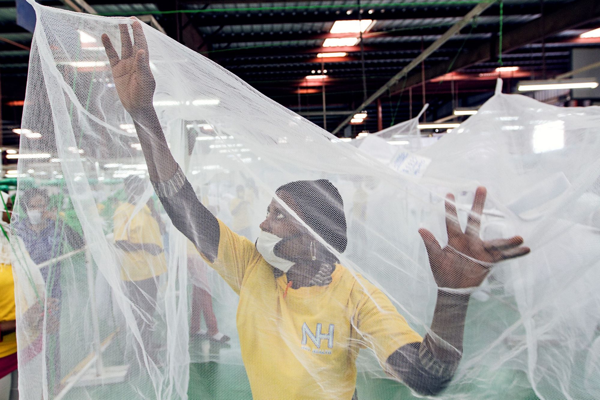 Worker in a bed net factory (Photo: Matthis Kleeb/Swiss TPH)