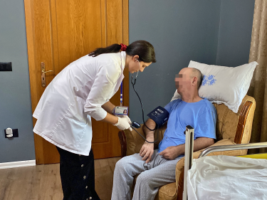 Nurse caring for patient at home (HAP Albania)