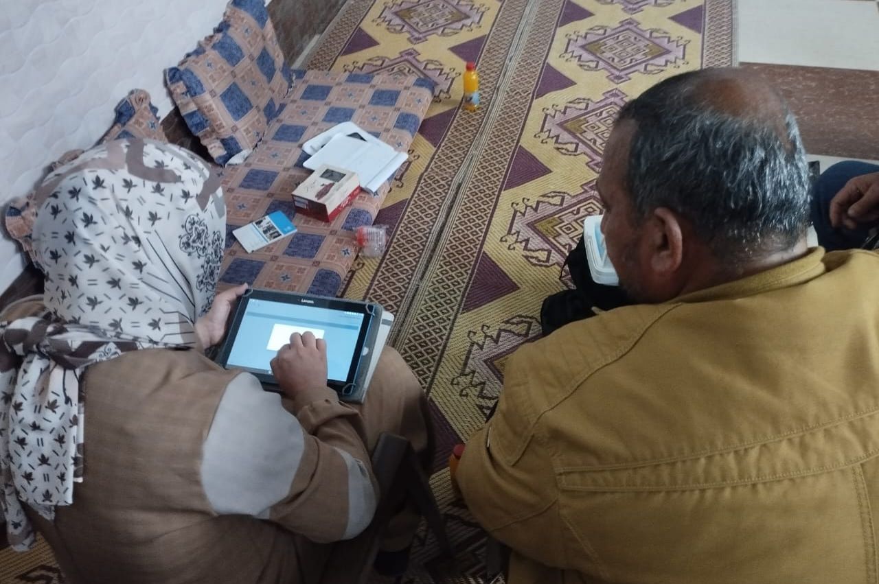 A researcher interviews a man