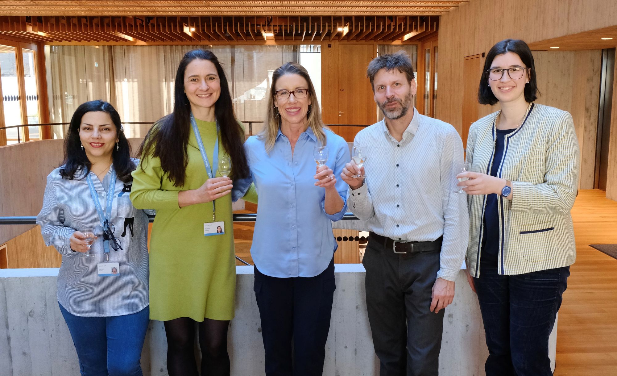 Group photo with Cristin and supervisors toasting to Cristin