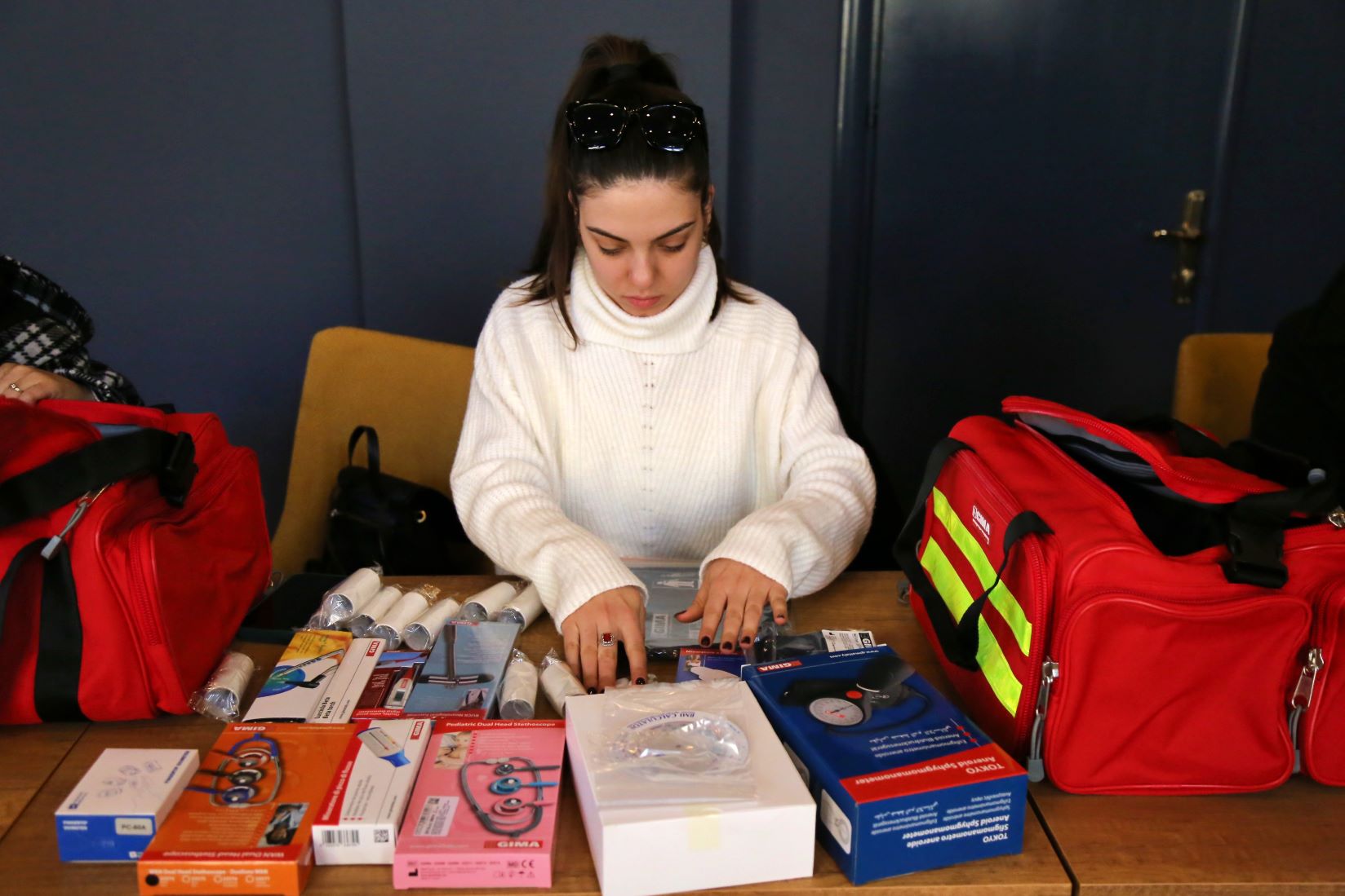 Nurse inspecting a medical kit