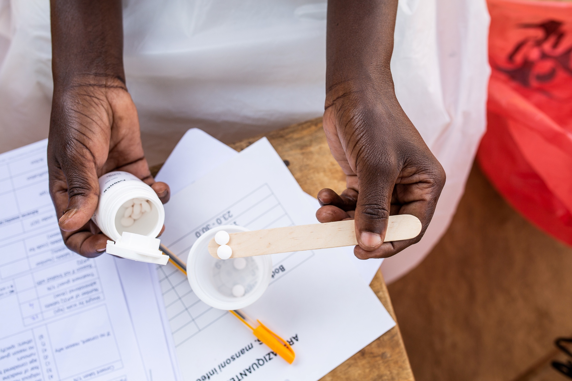 The correct dosage is measured (Photo: Kibuuka Makisa/Candid Local)