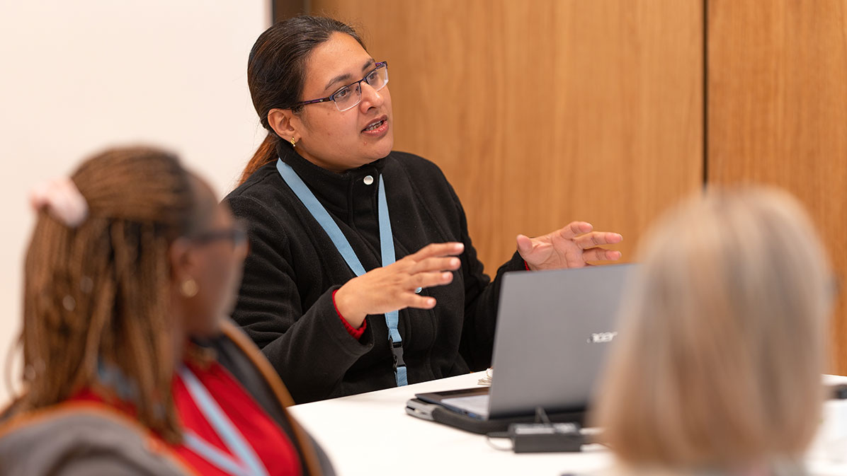 Students discussing in a CAS Health Systems and Management lecture